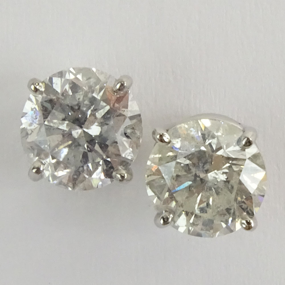 AIG Certified 2.47 Carat, total weight, Round Brilliant Cut Diamond and 14 Karat White Gold Earstuds.