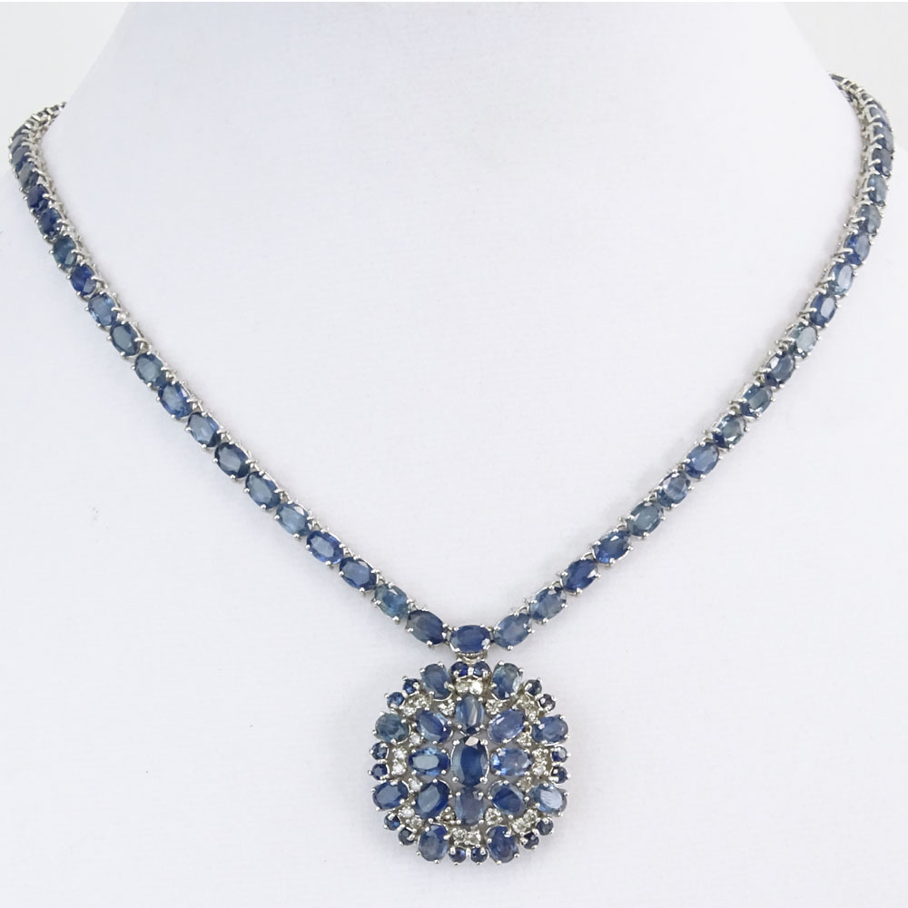 AIG Certified 52.46 Carat Oval Cut Sapphire, .87 Carat Round Brilliant Cut Diamond and 14 Karat White Gold Pendant Necklace.