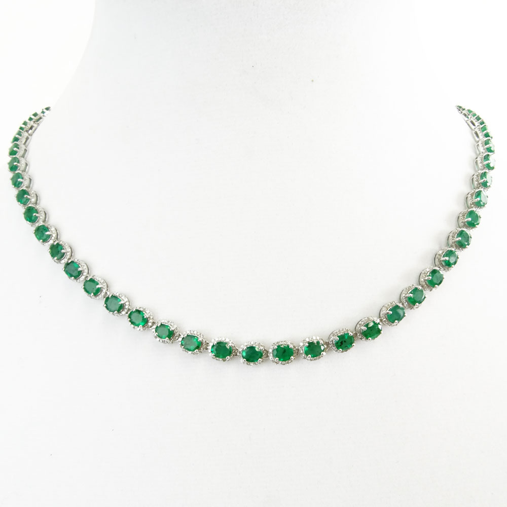 AIG Certified 20.63 Carat Oval Cut Emerald, 3.95 Carat Round Brilliant Cut Diamond and 14 Karat White Gold Necklace. 