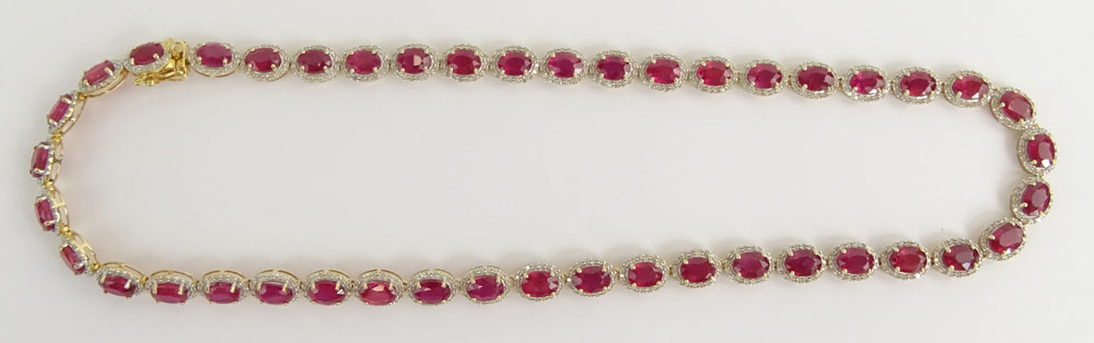 AIG Certified 48.49 Carat Oval Cut Ruby, 4.27 Carat Round Brilliant Cut Diamond and 14 Karat Yellow Gold Necklace. 