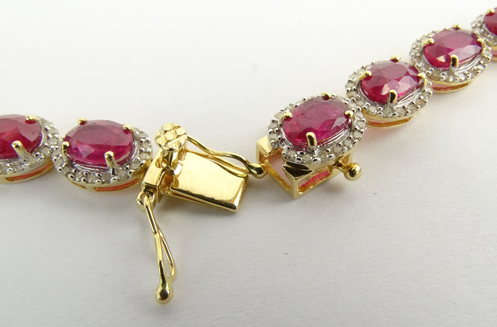 AIG Certified 48.49 Carat Oval Cut Ruby, 4.27 Carat Round Brilliant Cut Diamond and 14 Karat Yellow Gold Necklace. 