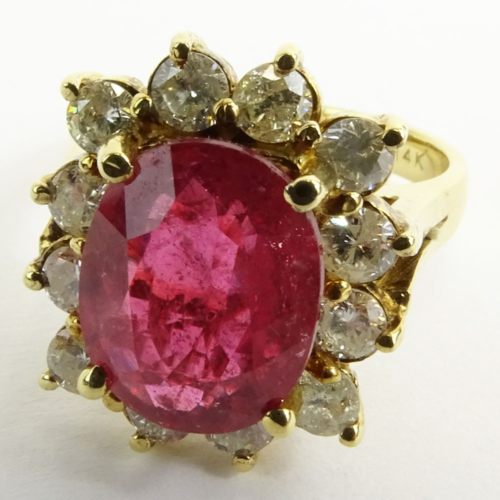 GLA Certified 3.57 Carat Oval Cut Ruby, 1.03 Carat Round Cut Diamond and 14 Karat Yellow Gold Ring. 