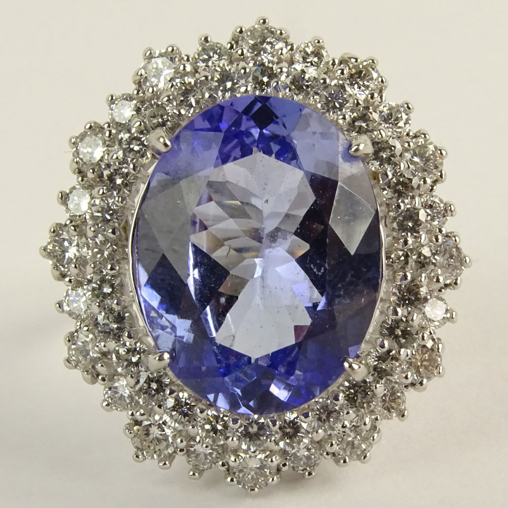 Lady's Oval Cut Tanzanite, Round Brilliant Cut Diamond and 18 Karat White Gold Ring.