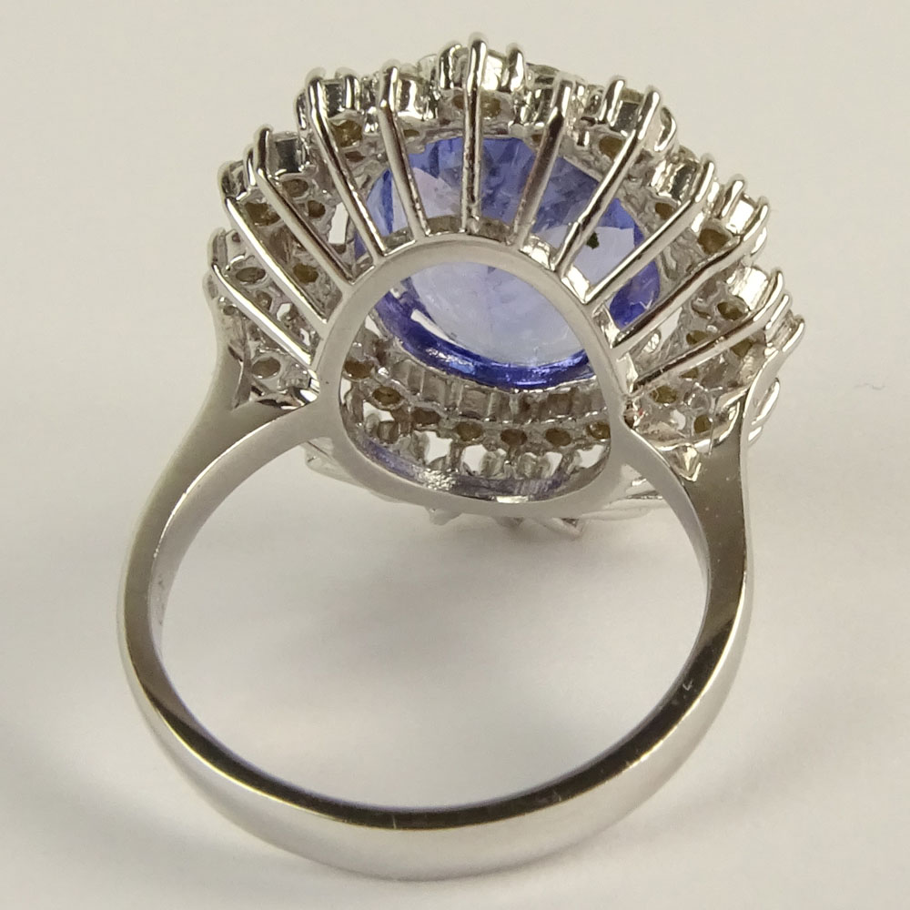 Lady's Oval Cut Tanzanite, Round Brilliant Cut Diamond and 18 Karat White Gold Ring.