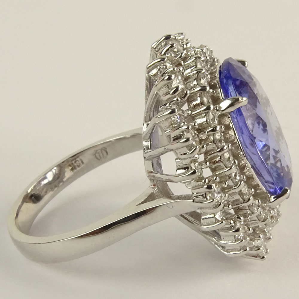 Lady's Oval Cut Tanzanite, Round Brilliant Cut Diamond and 18 Karat White Gold Ring.