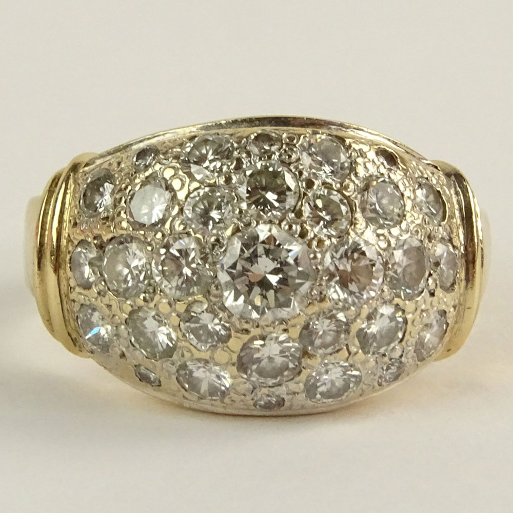 Lady's Pave Set Round Brilliant Cut Diamond and 14 Karat yellow Gold Ring.