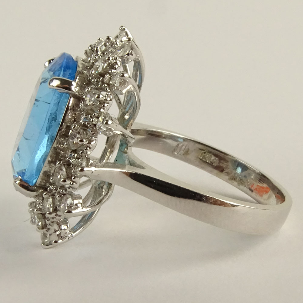 Lady's Oval Cut London Topaz, Round Brilliant Cut Diamond and 14 Karat White Gold Ring.