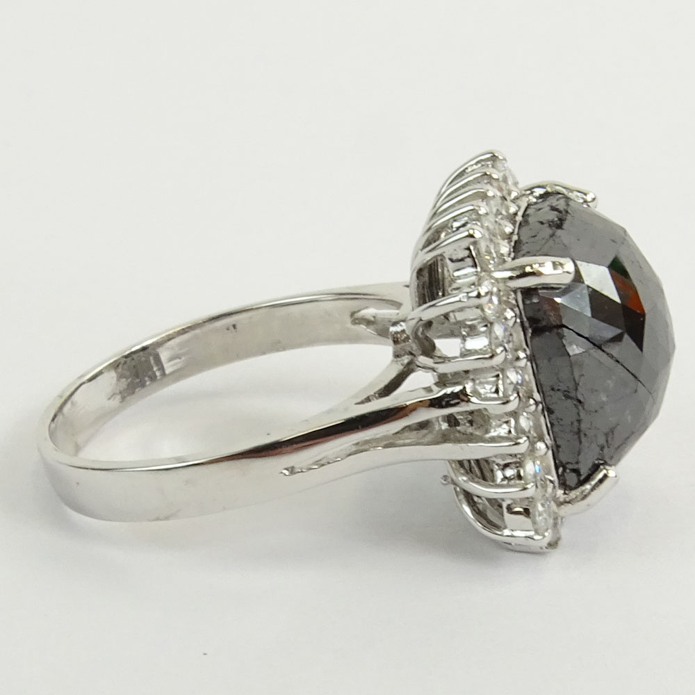 AIG Certified 7.22 Carat Cushion Cut Black Diamond and 14 Karat White Gold Ring accented with .69 Carat Round Brilliant Cut Diamonds.