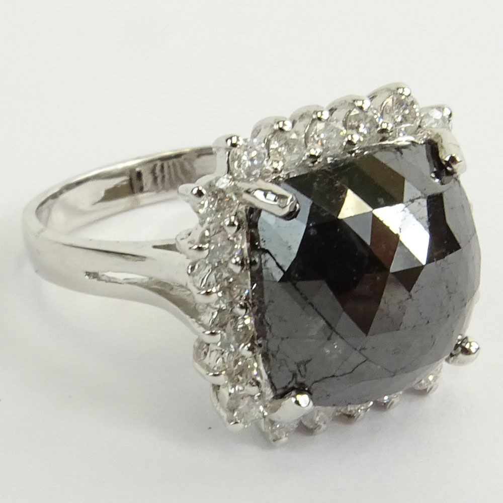 AIG Certified 7.22 Carat Cushion Cut Black Diamond and 14 Karat White Gold Ring accented with .69 Carat Round Brilliant Cut Diamonds.