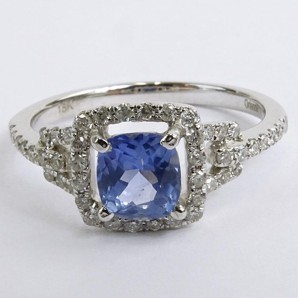 AIG Certified 1.09 Carat Cushion Mixed Cut Sapphire  and 18 Karat White Gold Ring Accented with .42 Carat Round Brilliant Cut Diamonds.