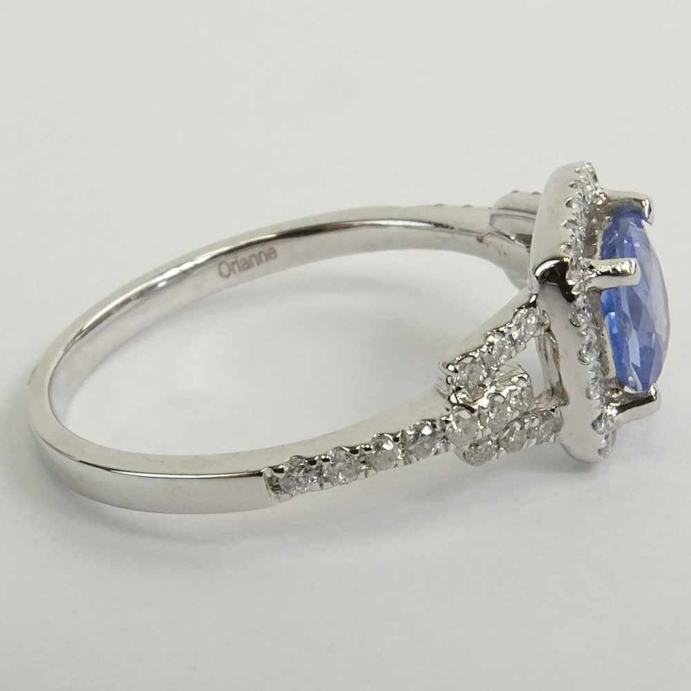 AIG Certified 1.09 Carat Cushion Mixed Cut Sapphire  and 18 Karat White Gold Ring Accented with .42 Carat Round Brilliant Cut Diamonds.