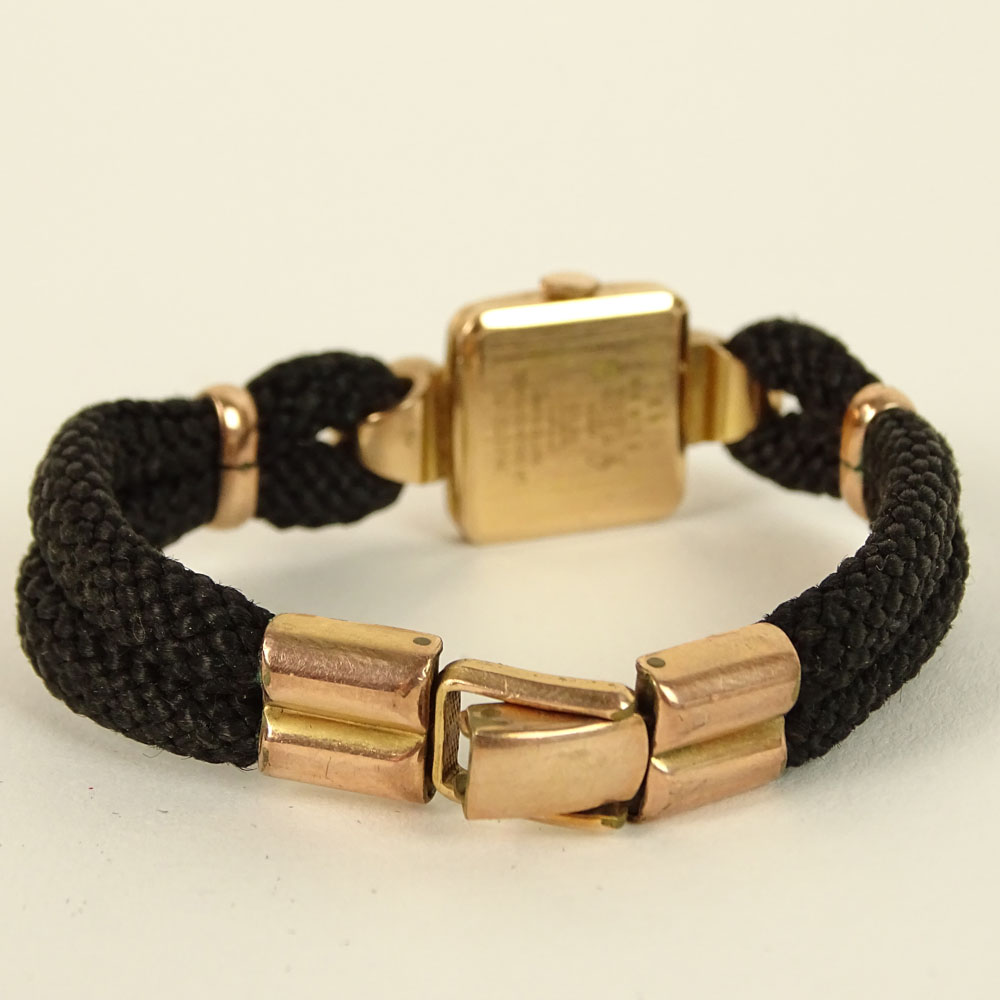 Ladies Vintage 14K Rose Gold Watch On Braided Band. Signed Invicta and other various marks.