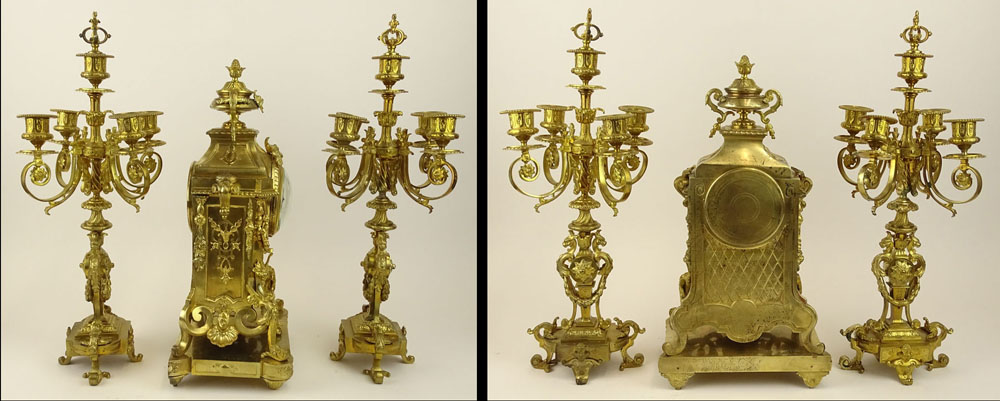 Antique Three (3) piece French ormolu bronze clock garniture set. Figural motif, hand painted dial. 