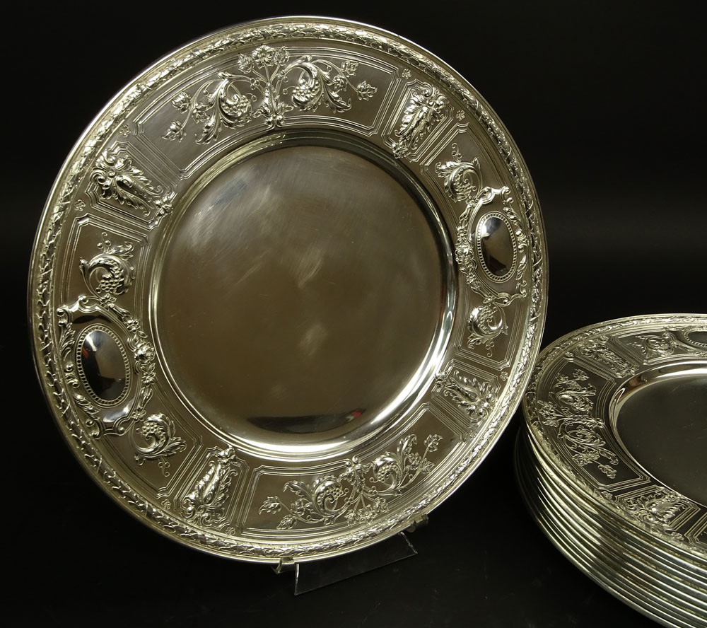 Twelve (12) Circa 1896 Gorham Sterling Silver Service Plates in the Maintenon Pattern.