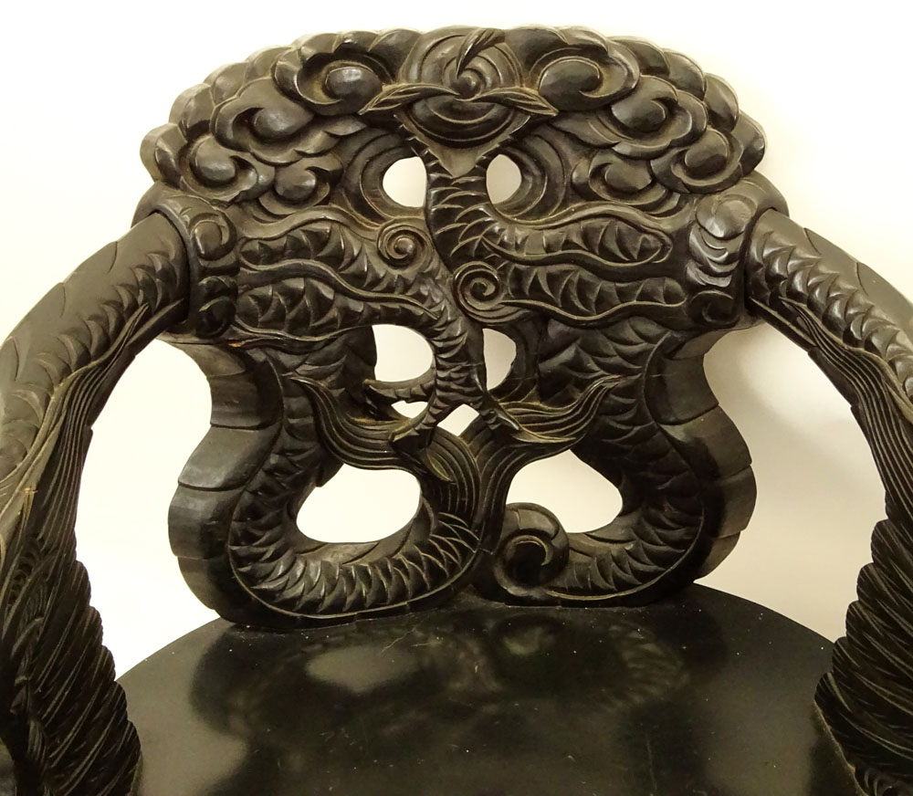 Pair of 20th Century Chinese Carved Wood Dragon Arm Chairs. Inset eyes.