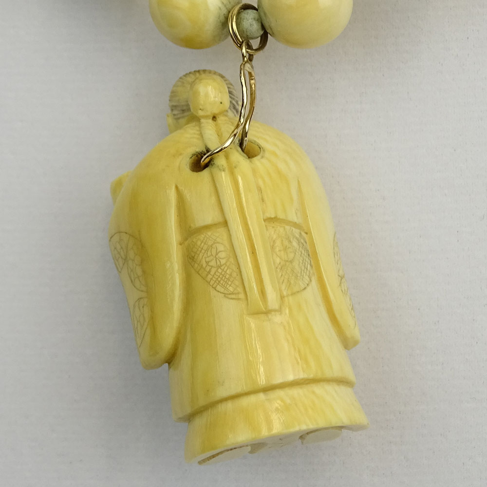 Japanese Ivory Bead Necklace with Carved Ivory Figural Pendant.