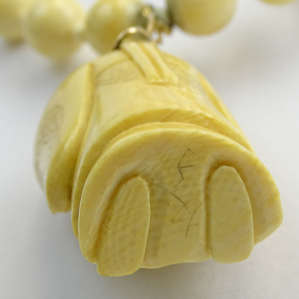 Japanese Ivory Bead Necklace with Carved Ivory Figural Pendant.