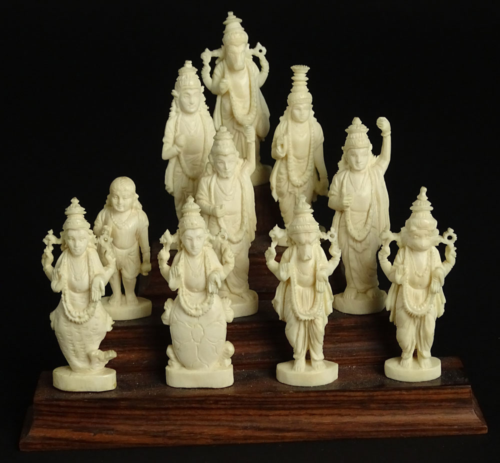 Ten (10) Indian Carved Ivory Deity Figures on Stepped Wood Base.