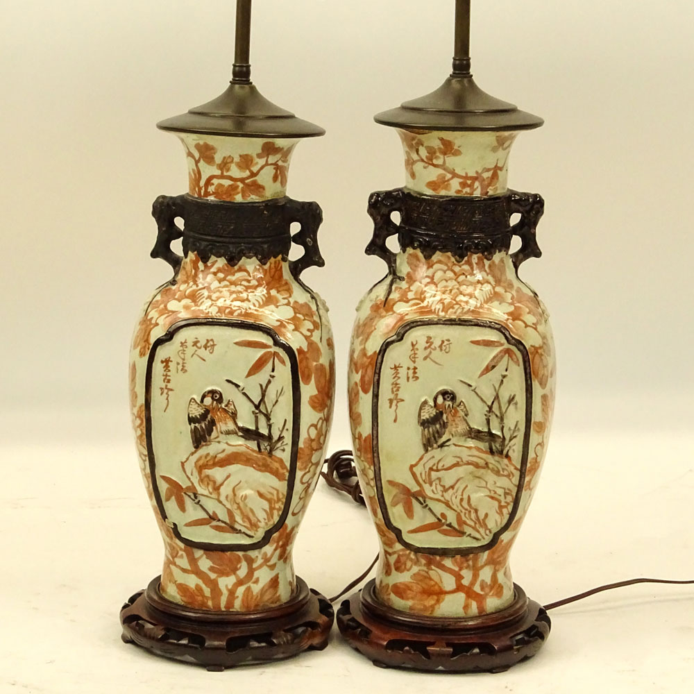 Pair of Chinese Pottery Urn Lamps on Hardwood Bases.