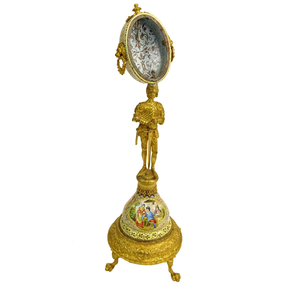 Early 20th Century Vienna Enamel and Gilt Metal Watch Holder. Unsigned. Losses/Damages to finial and to watch holder. Please examine this lot carefully before bidding. Measures 13-1/2" H (without bird finial), 4" W at base. Shipping $48.00 (estimate $500-