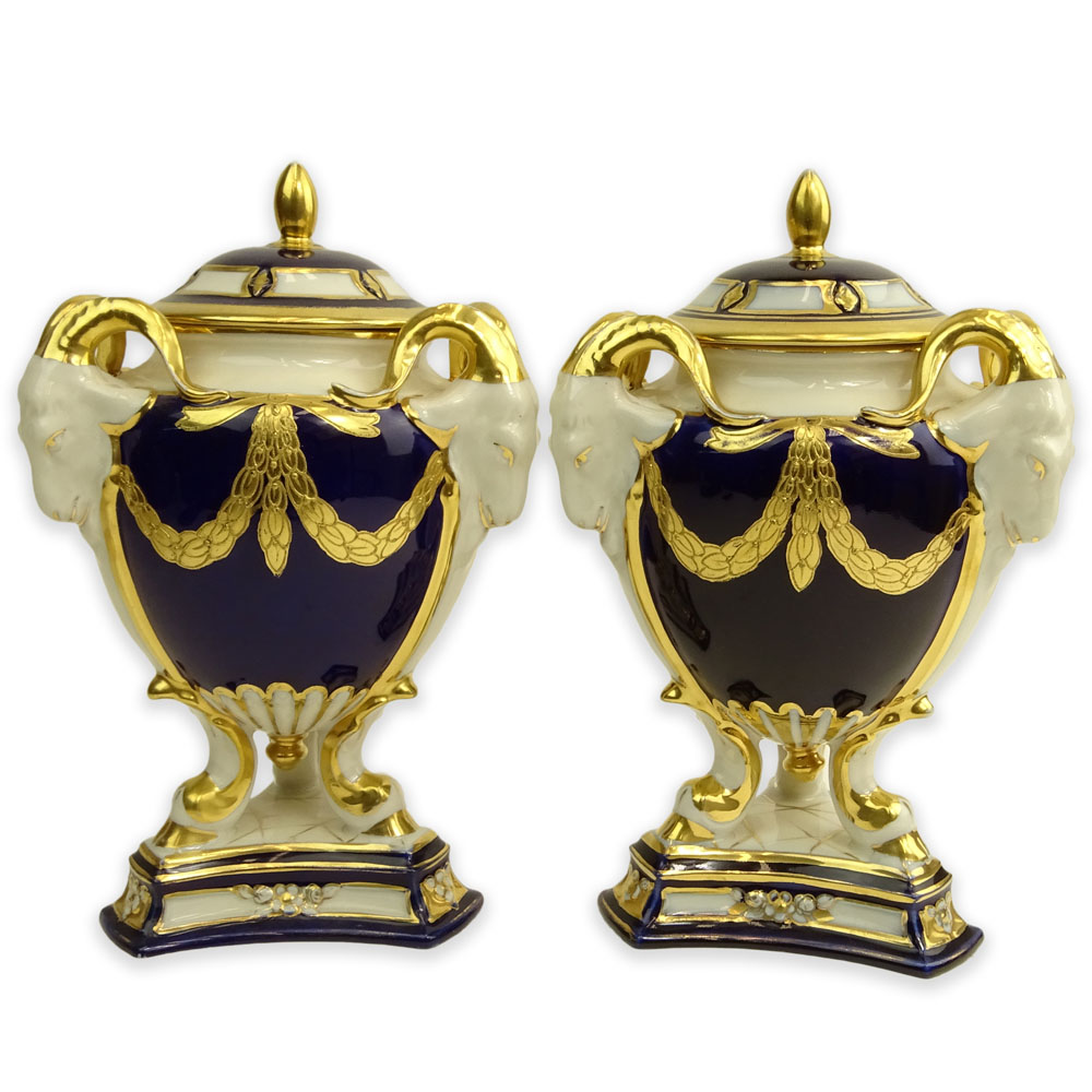 Pair Royal Dux Porcelain Cobalt and Parcel Gilt Covered Urns. Ram's head handles.