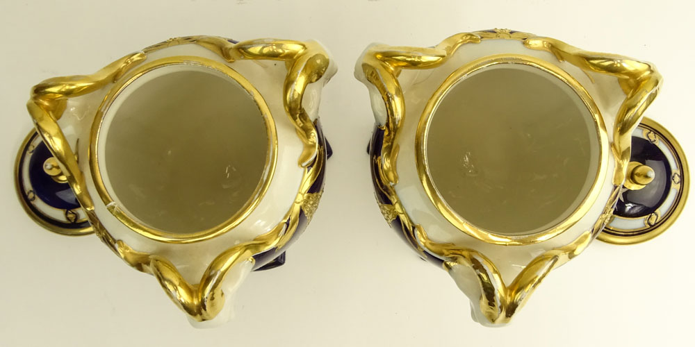 Pair Royal Dux Porcelain Cobalt and Parcel Gilt Covered Urns. Ram's head handles.