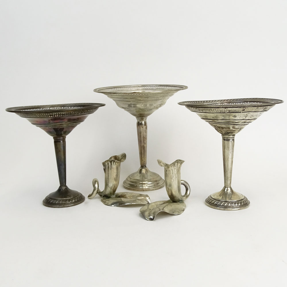 Three Weighted Sterling Silver Compotes and a Pair of 900 Silver Flower Candlesticks.