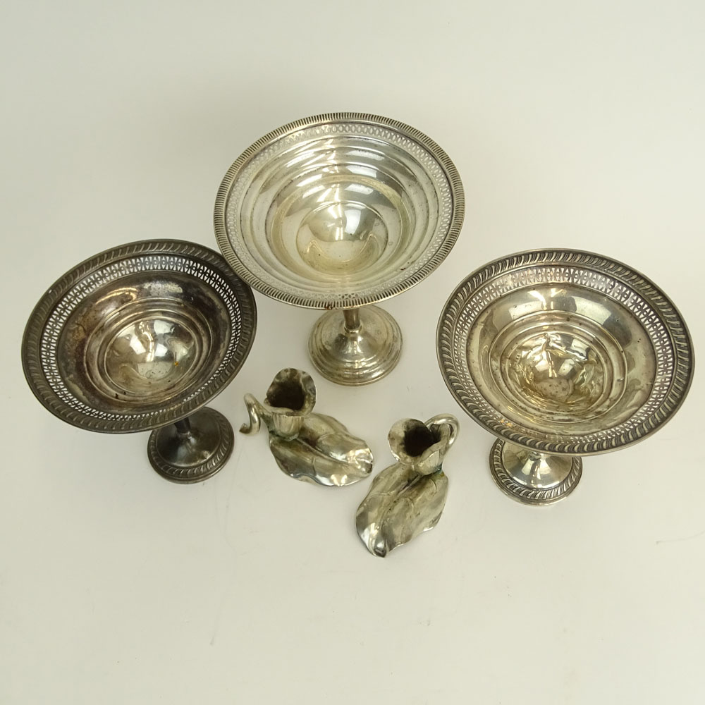 Three Weighted Sterling Silver Compotes and a Pair of 900 Silver Flower Candlesticks.