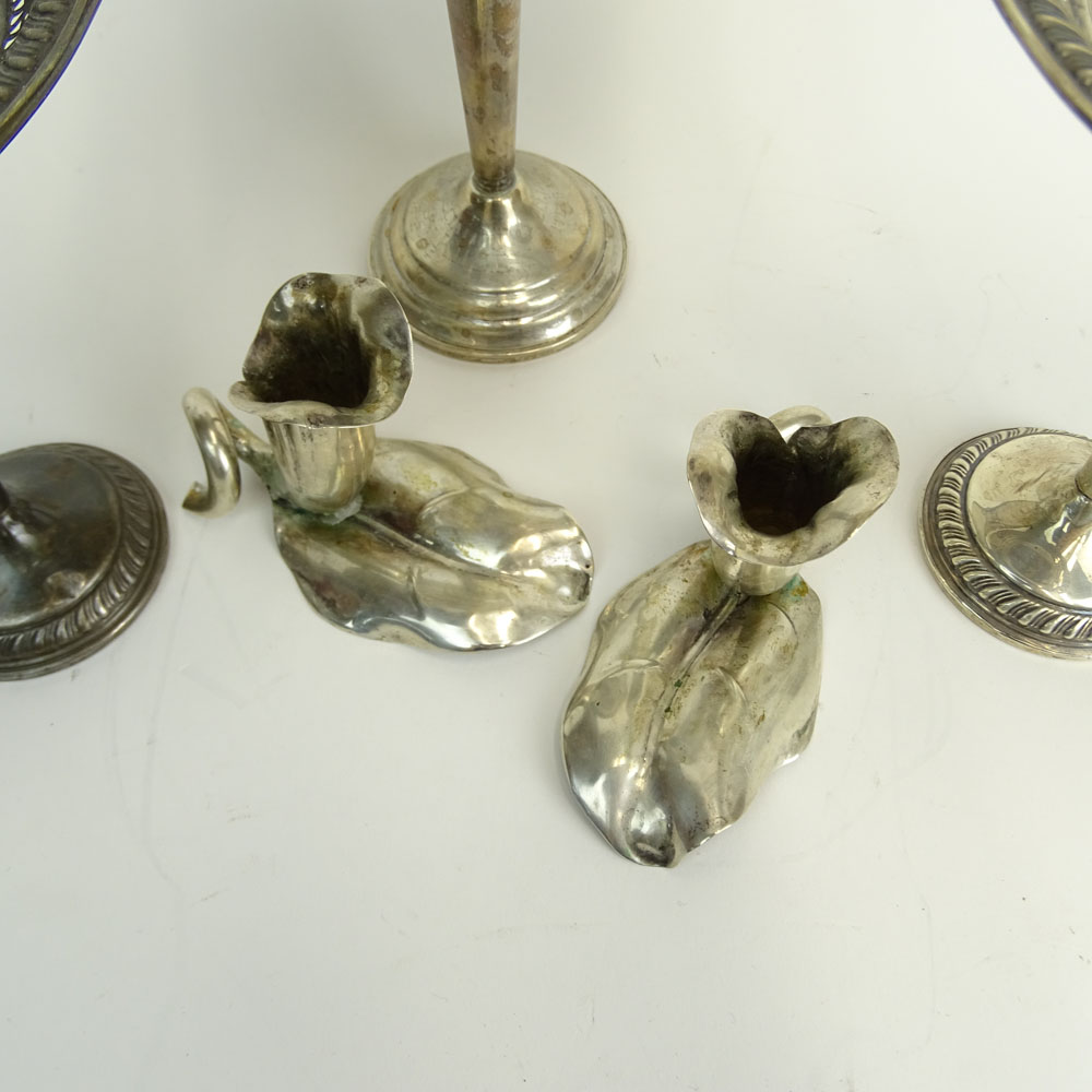 Three Weighted Sterling Silver Compotes and a Pair of 900 Silver Flower Candlesticks.