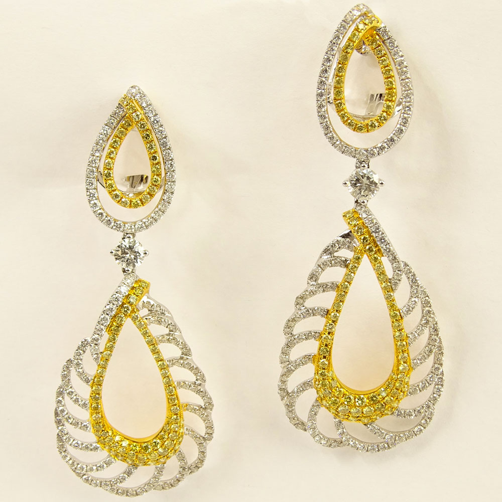 Lady's Round Brilliant Cut Yellow and White Diamond and 18 Karat Gold Chandelier Earrings.