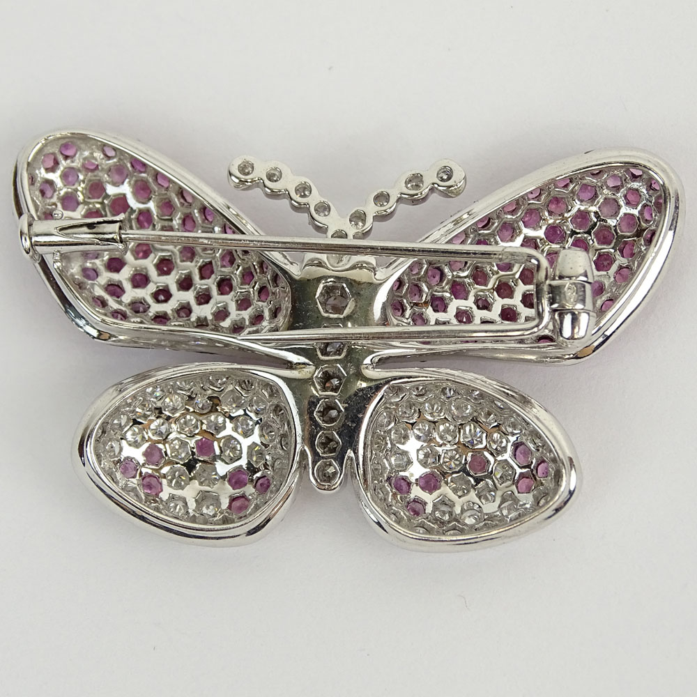 18 Karat White Gold, Round Cut Diamond and Pink Sapphire Butterfly Brooch. Diamonds G-H color, VS-SI clarity. Signed 750. Very good condition. Measures 1-1/8" H, 1-7/8" W. Approx. weight: 10.40 pennyweights. Shipping $28.00 (estimate $1500-$2000)