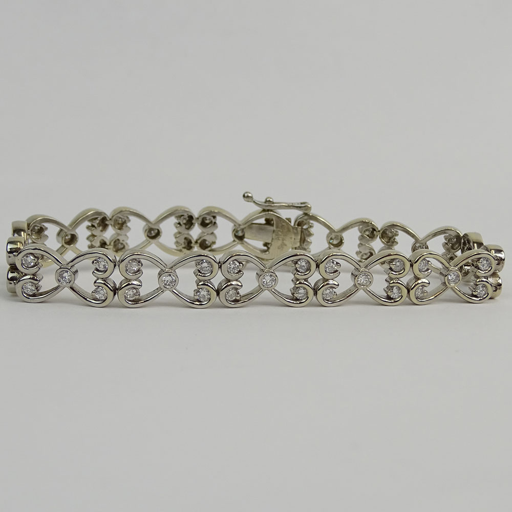 Lady's Diamond and 14 Karat White Gold Bracelet. Signed 14K.