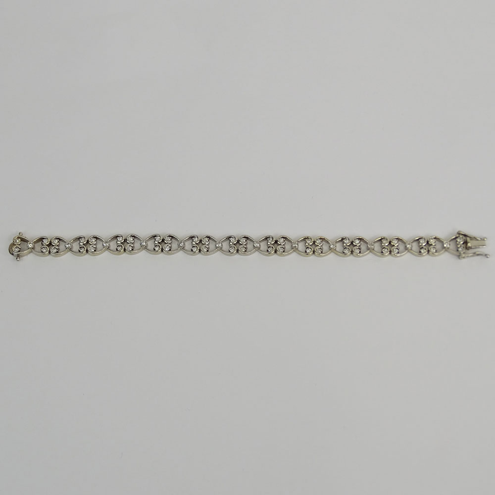 Lady's Diamond and 14 Karat White Gold Bracelet. Signed 14K.