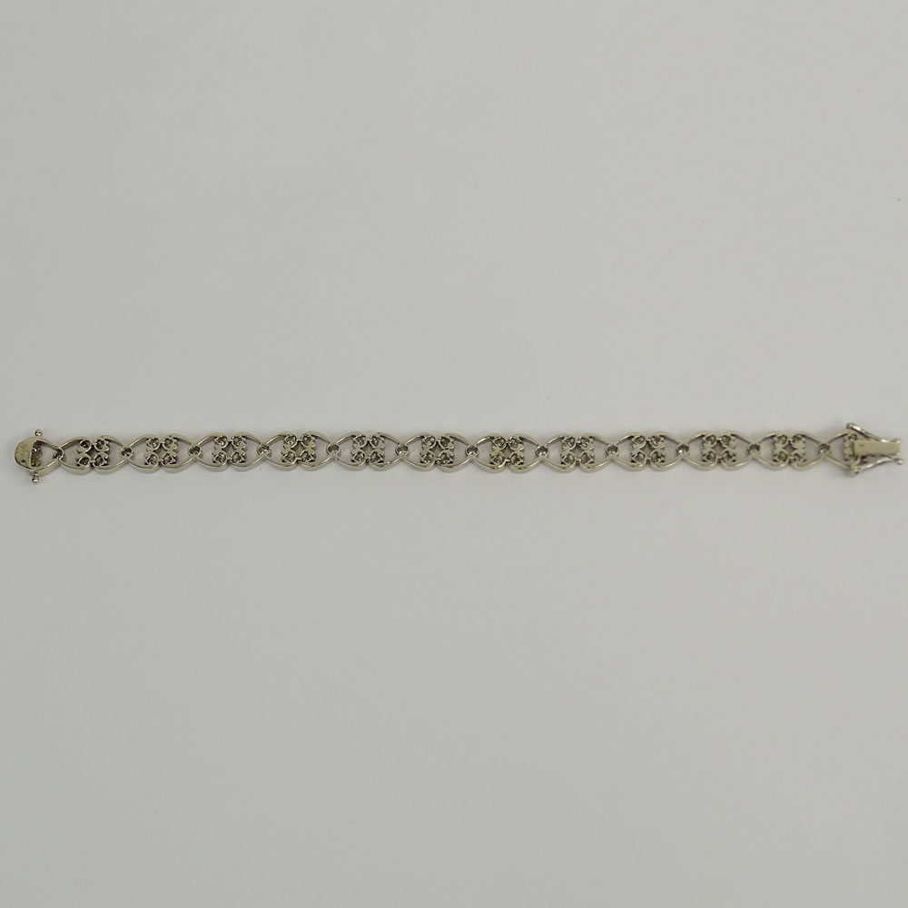 Lady's Diamond and 14 Karat White Gold Bracelet. Signed 14K.