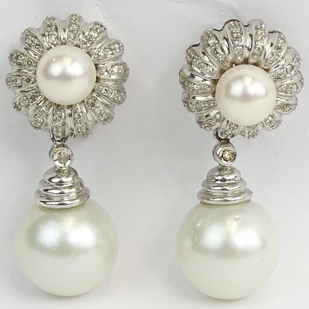 South Sea White Pearl, .90 Carat Round Cut Diamond and 18 Karat White Gold Pendant Earrings.