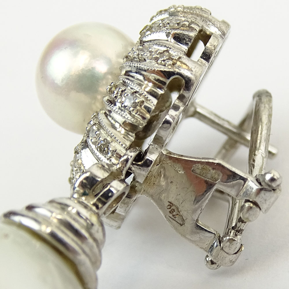 South Sea White Pearl, .90 Carat Round Cut Diamond and 18 Karat White Gold Pendant Earrings.