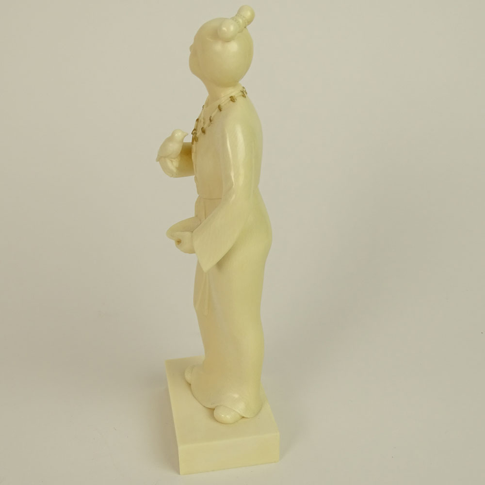 Japanese Finely Carved Ivory Figure of a Female Holding a Bird and Dish.