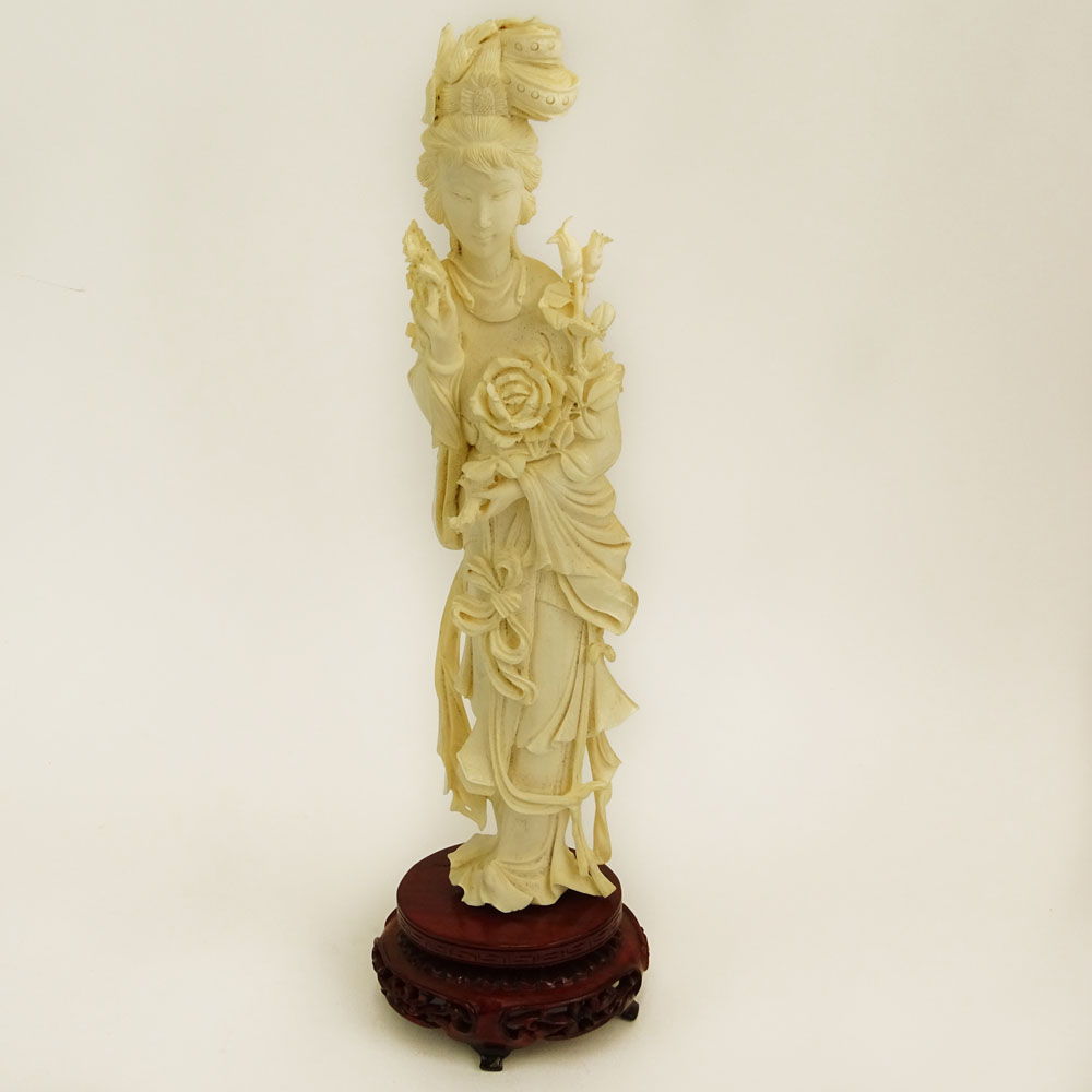 Mid 20th Century Chinese Carved Ivory Guanyin Figure on Carved Wood Base.