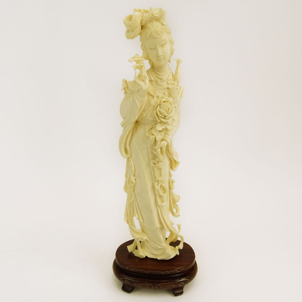 Mid 20th Century Chinese Carved Ivory Guanyin Figure on Carved Wood Base.