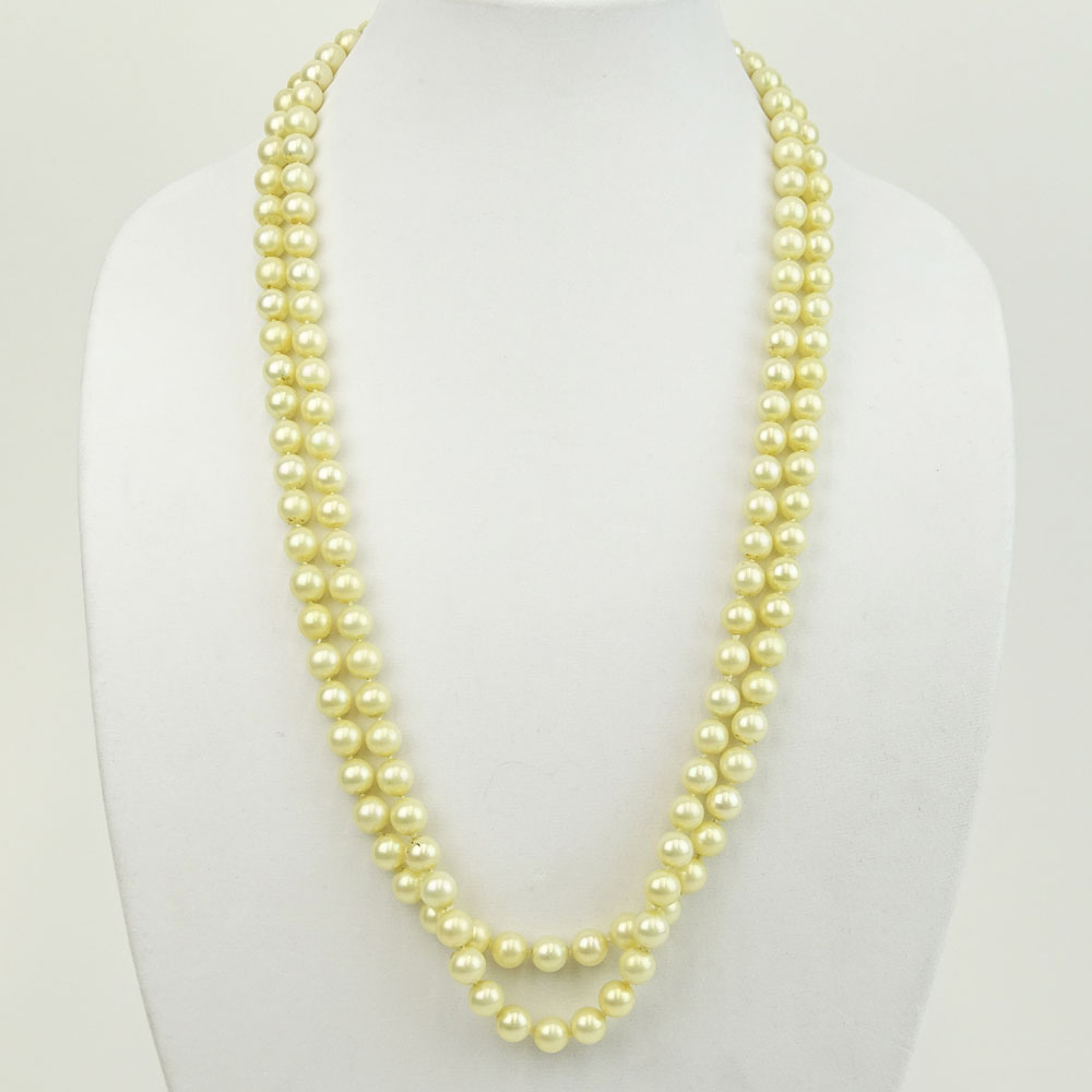 Vintage 9.50-9.60mm White Pearl Double Strand Necklace with 14 Karat Gold and Diamond Clasp.