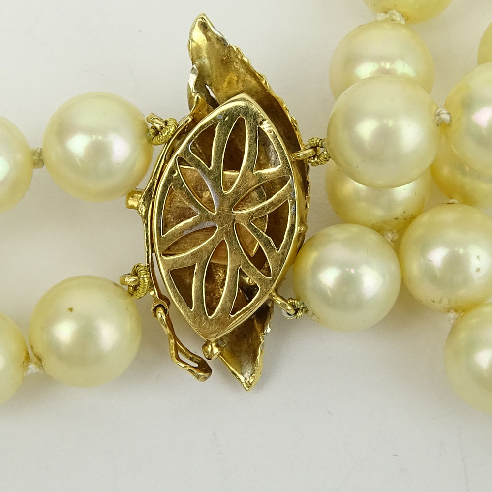 Vintage 9.50-9.60mm White Pearl Double Strand Necklace with 14 Karat Gold and Diamond Clasp.