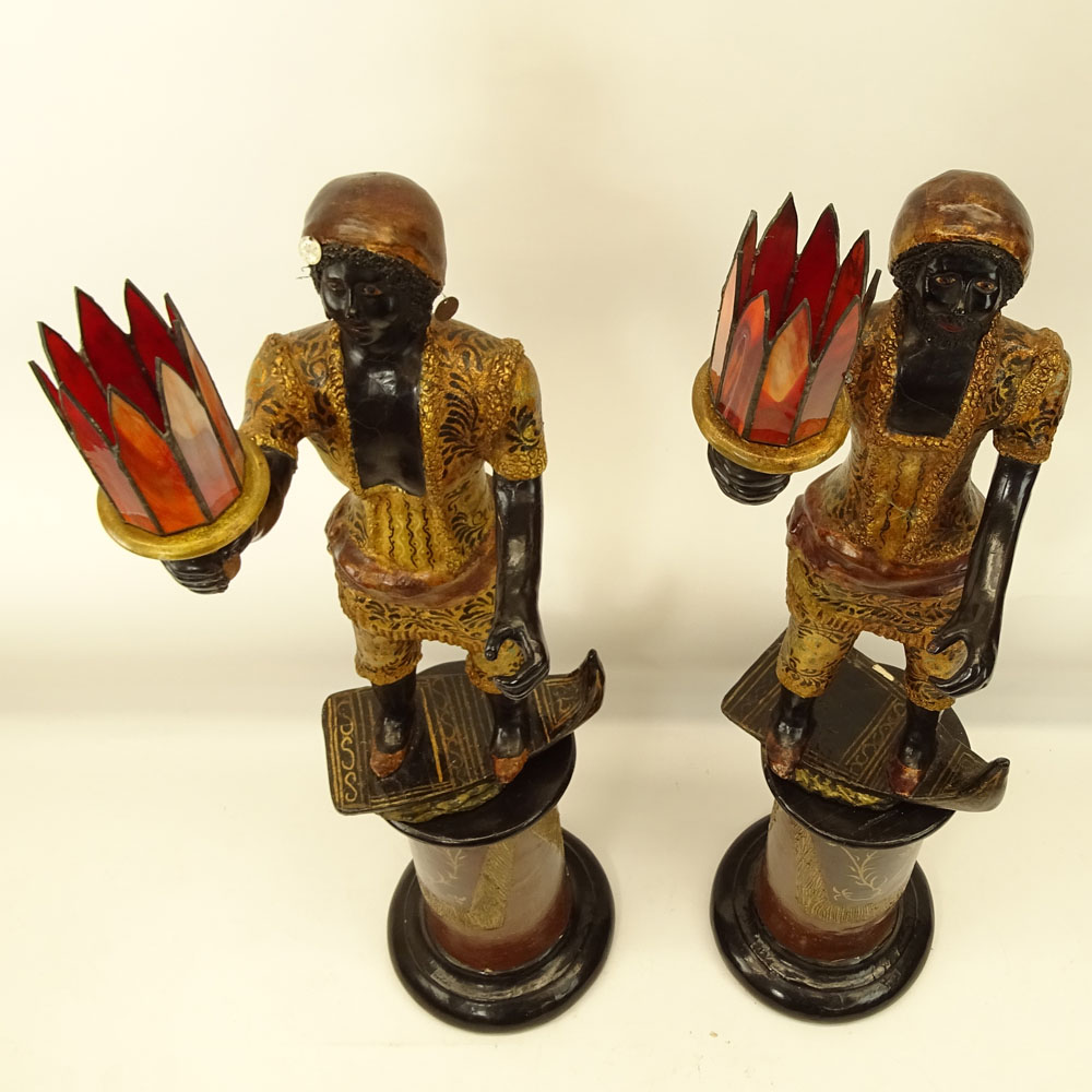 Pair of Early to Mid 20th Century Venetian style Carved Painted and Parcel Gilt Blackamoor Gondolier Figures on Bases.