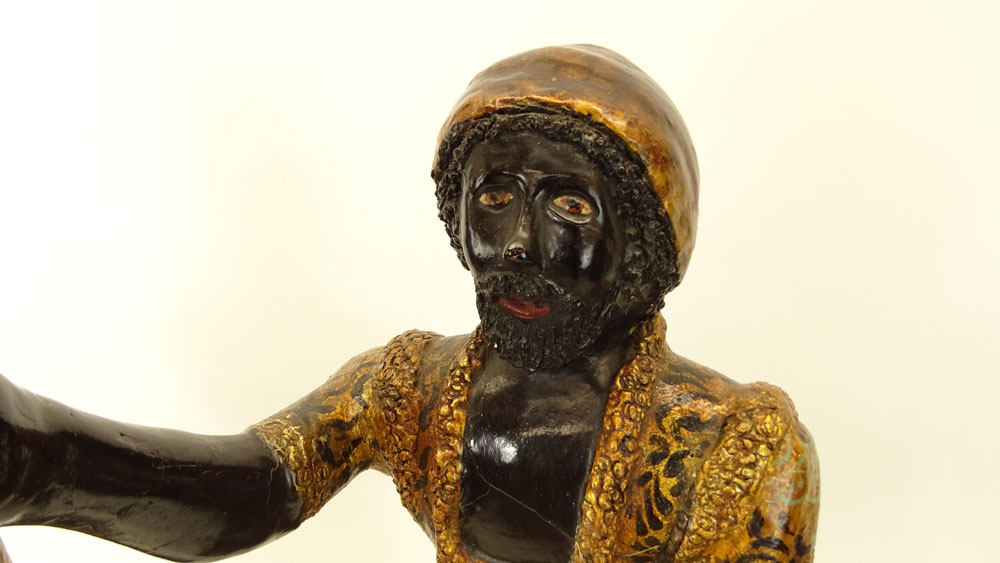 Pair of Early to Mid 20th Century Venetian style Carved Painted and Parcel Gilt Blackamoor Gondolier Figures on Bases.