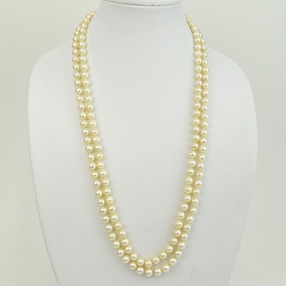 Long Vintage Double Strand White Pearl Necklace with 14 Karat Yellow Gold Clasp with Small Diamond Accents.