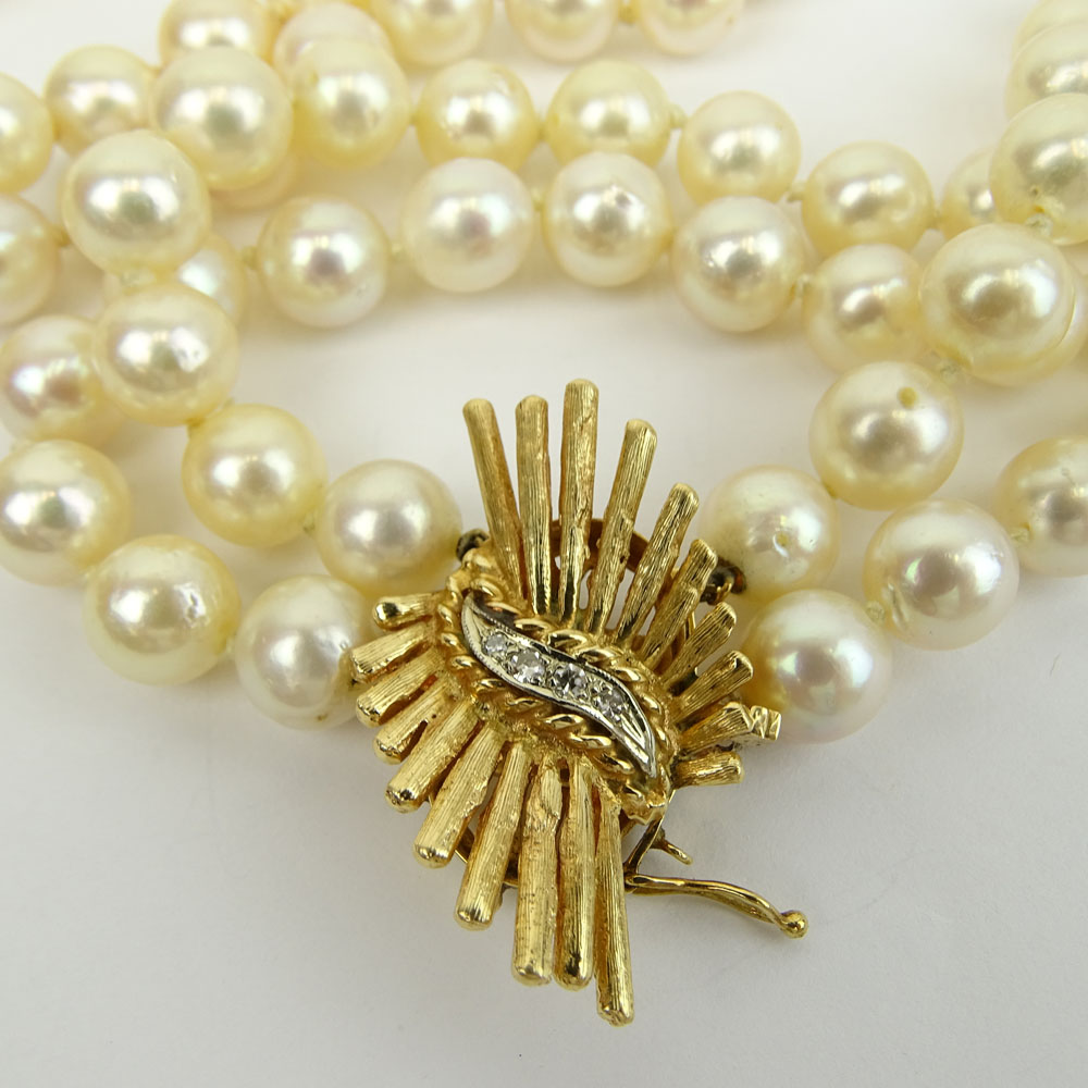 Long Vintage Double Strand White Pearl Necklace with 14 Karat Yellow Gold Clasp with Small Diamond Accents.