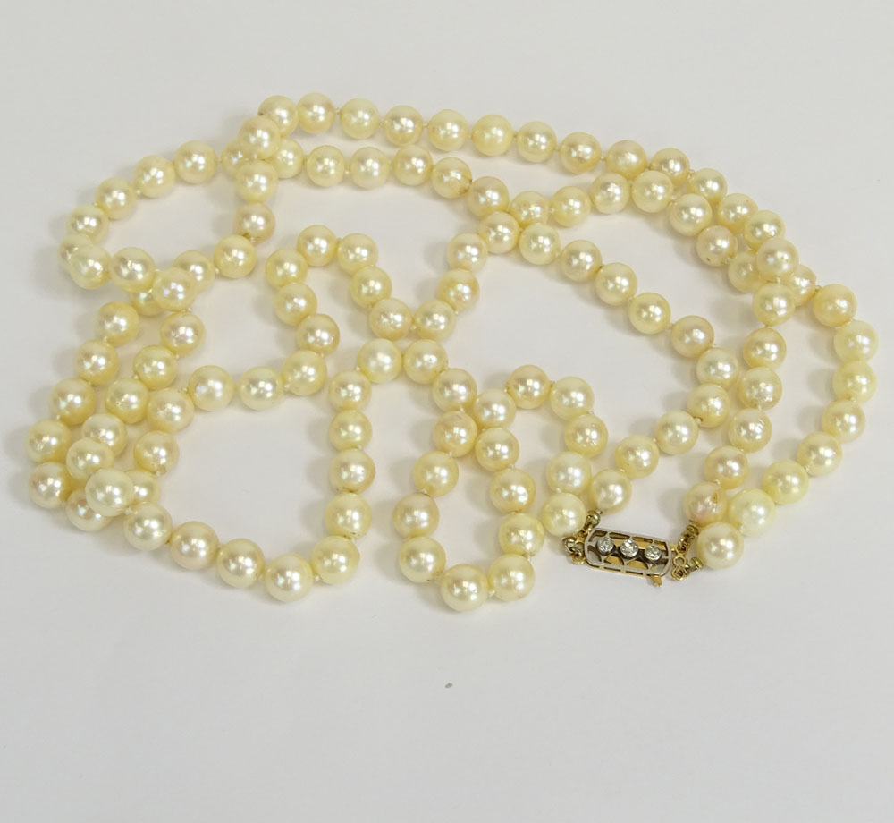 Vintage 9.00 mm White Pearl Double Strand Necklace with 14 Karat Gold and Diamond Clasp.