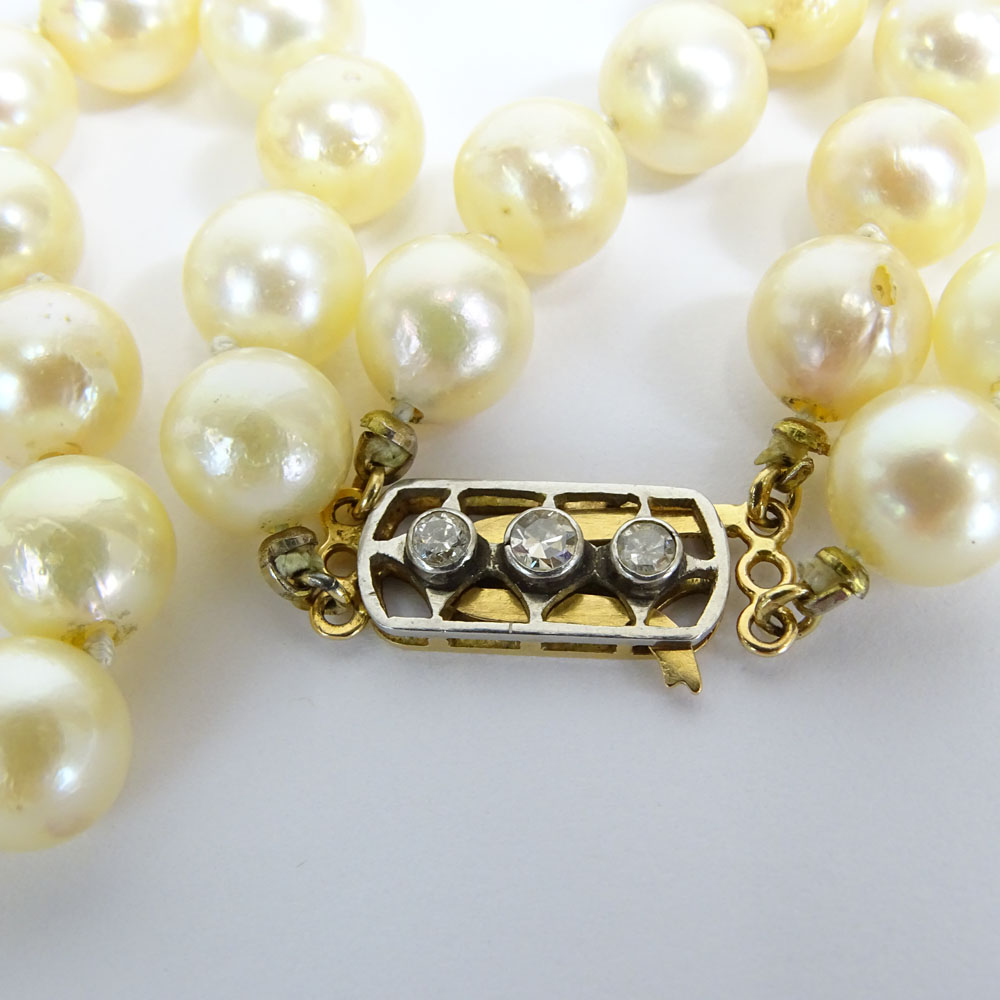 Vintage 9.00 mm White Pearl Double Strand Necklace with 14 Karat Gold and Diamond Clasp.