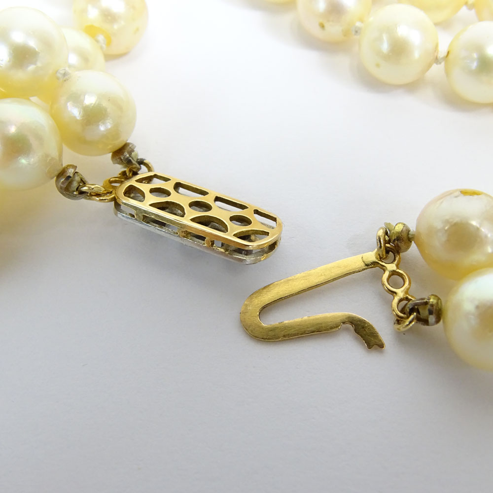 Vintage 9.00 mm White Pearl Double Strand Necklace with 14 Karat Gold and Diamond Clasp.