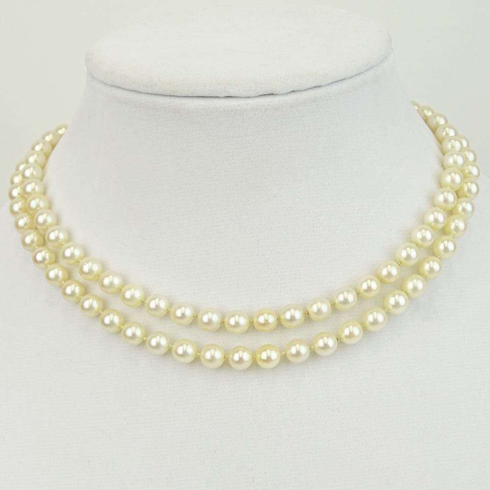 Vintage Double Strand White Pearl Necklace with 14 Karat White Gold and Diamond Clasp.