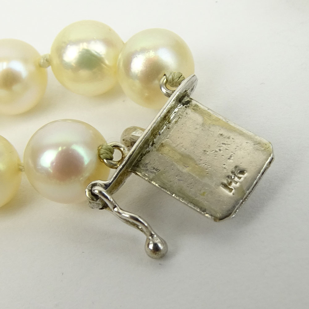 Vintage Double Strand White Pearl Necklace with 14 Karat White Gold and Diamond Clasp.